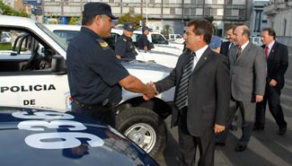 policiaurribarricamionetas.jpg